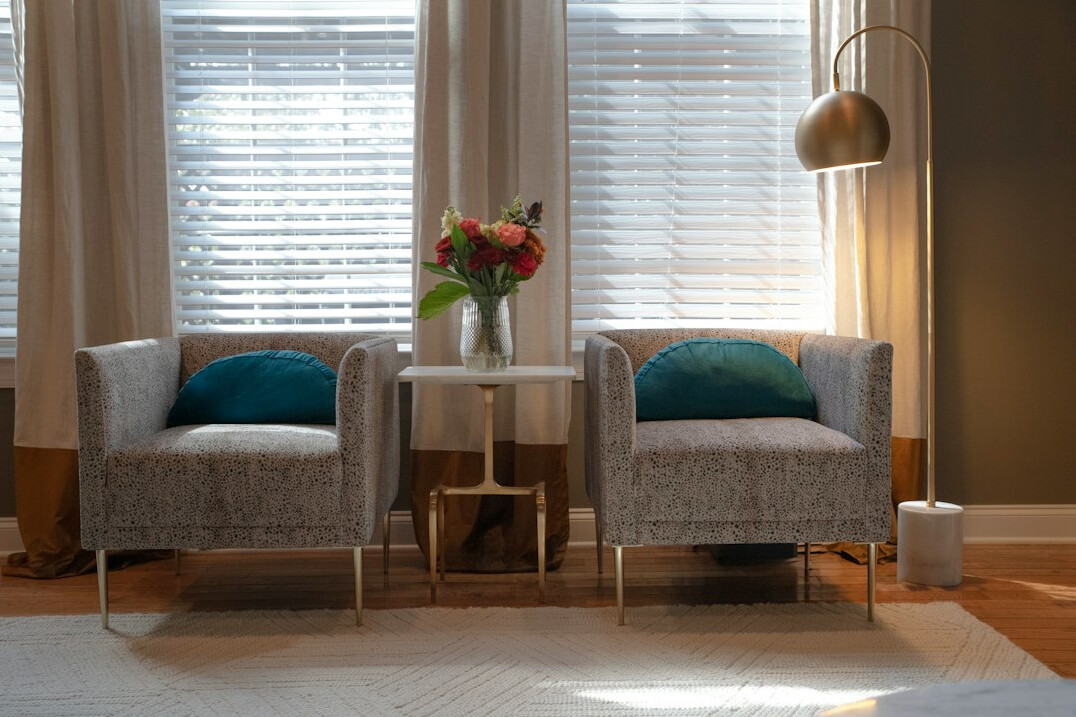 Two armchairs facing each other in a bright living room