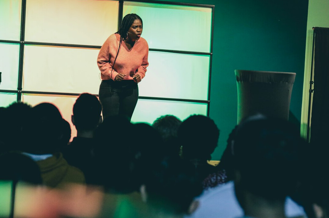 confident speaker on stage