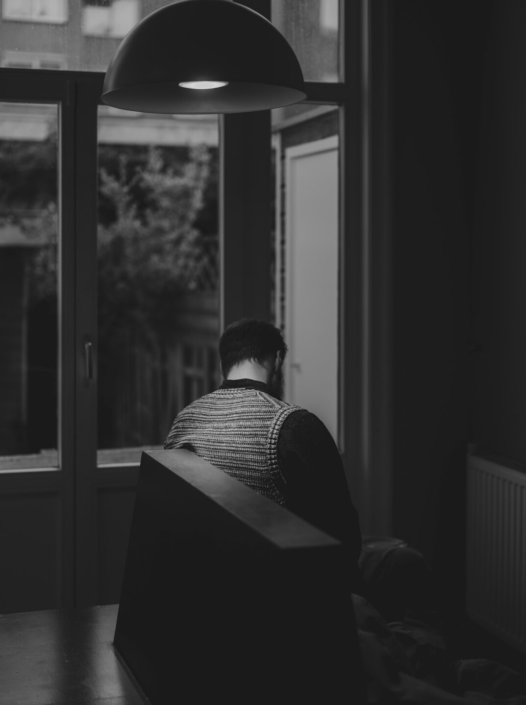 man reading book in quiet room