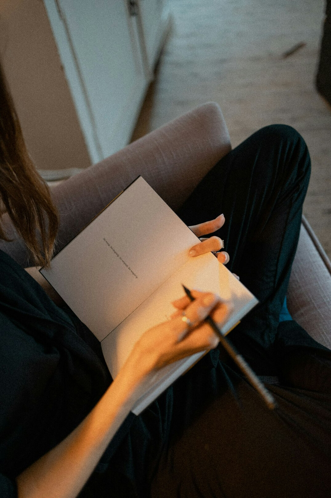 woman writing in notebook